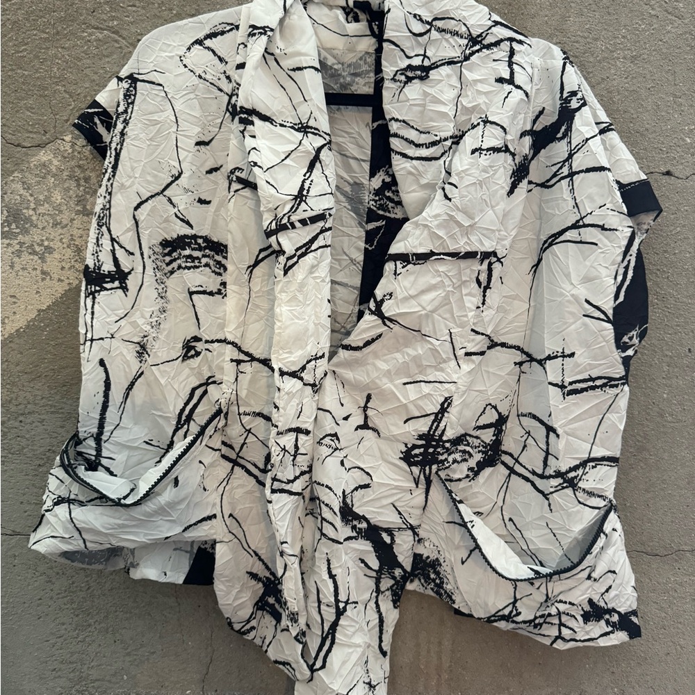 Kozan vest. Black and white. Would fit to size large. 23” armpit to armpit.